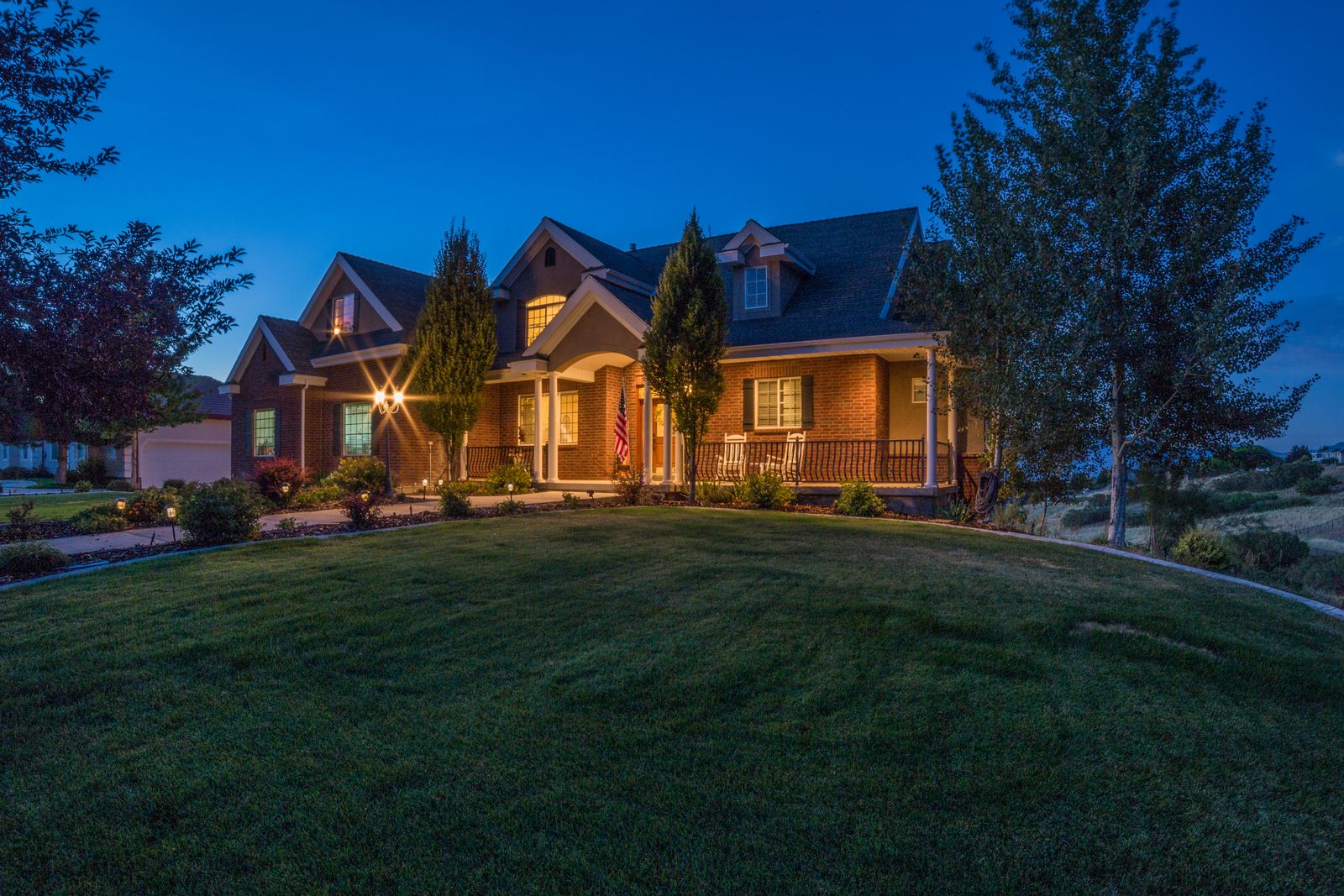Home glowing in warm white light at dusk